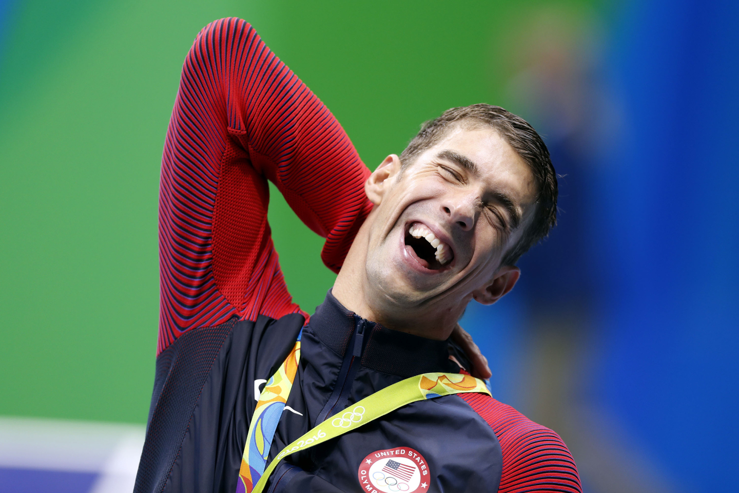 Michael Phelps of the United States of America reacts during the awarding ceremony for men?s 4x200m freestyle relay final of swimming at the 2016 Rio Olympic Games in Rio de Janeiro, Brazil, on Aug. 9, 2016. The U.S. won the gold medal with 7 minute 0.66 seconds. / CHINA OUT