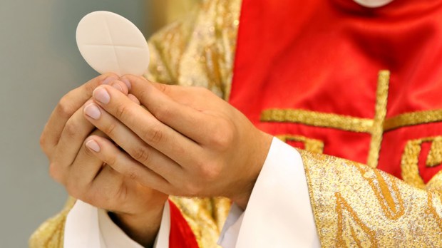 web3-priest-holy-communion-eucharist-wideonet-shutterstock