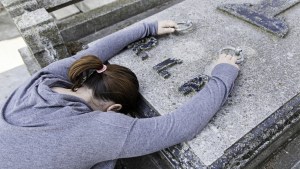 web3_girl_cementery_grave_mourning_celiafoto-shutterstock