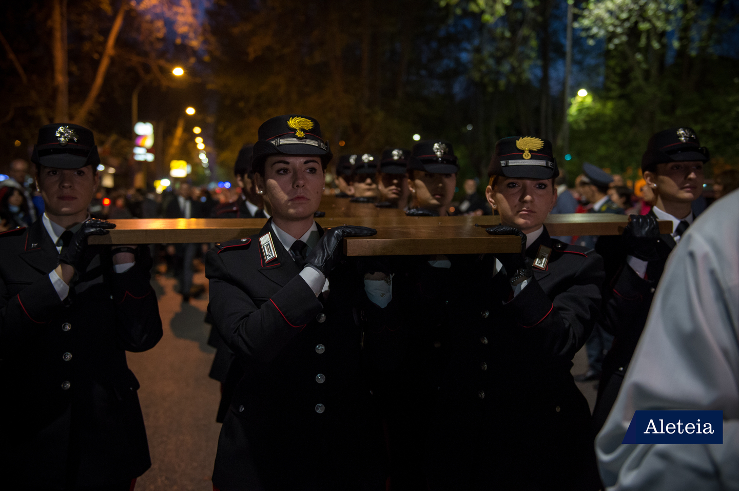 Women of Carabinieri corps carry the cross during via Crucis for