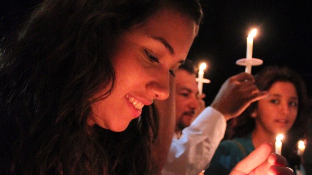 web-catholic-young-woman-candle-smile-vigil-prayitno-cc