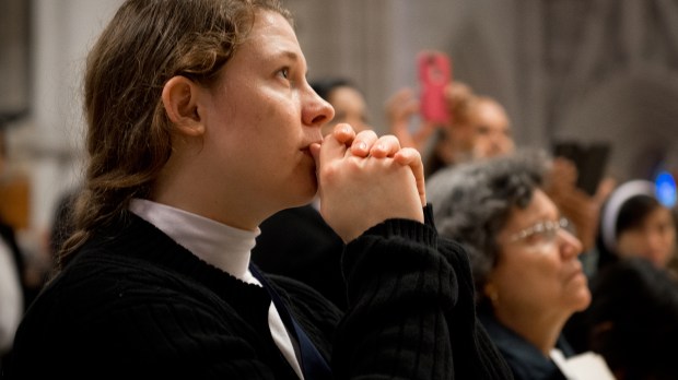 WEB-WOMAN-PRAYING-SWEATER-CHURCH-YOUNG-Jeffrey-Bruno