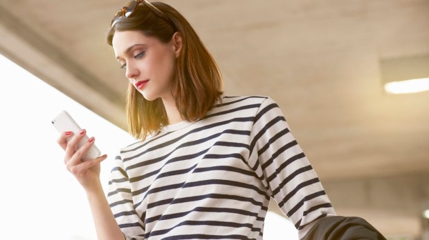 web3-woman-smartphone-stripes-light-tara-moore-getty-images