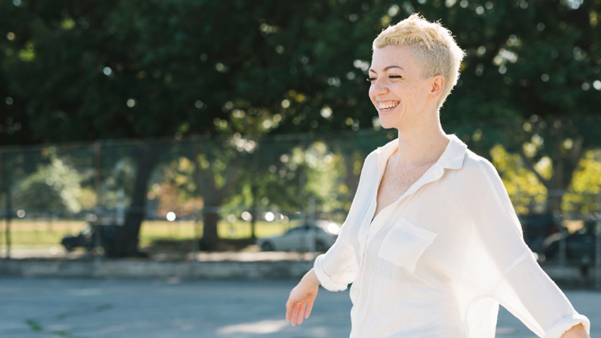 web3-woman-sun-light-smile-happiness-simone-becchetti-stocksy-united
