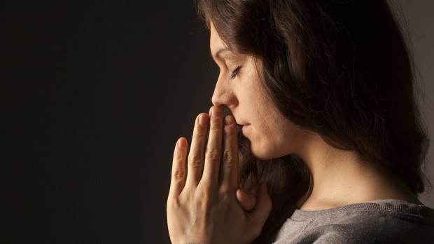 web3-praying-woman-face-closed-eyes-uvgreen-shutterstock