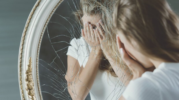 web3-woman-broken-mirror-depression-shutterstock