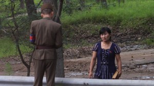 WEB3-NORTH KOREA-WOMAN-POLICE-CHECKPOINT-CONTROL-Roman Harak-cc