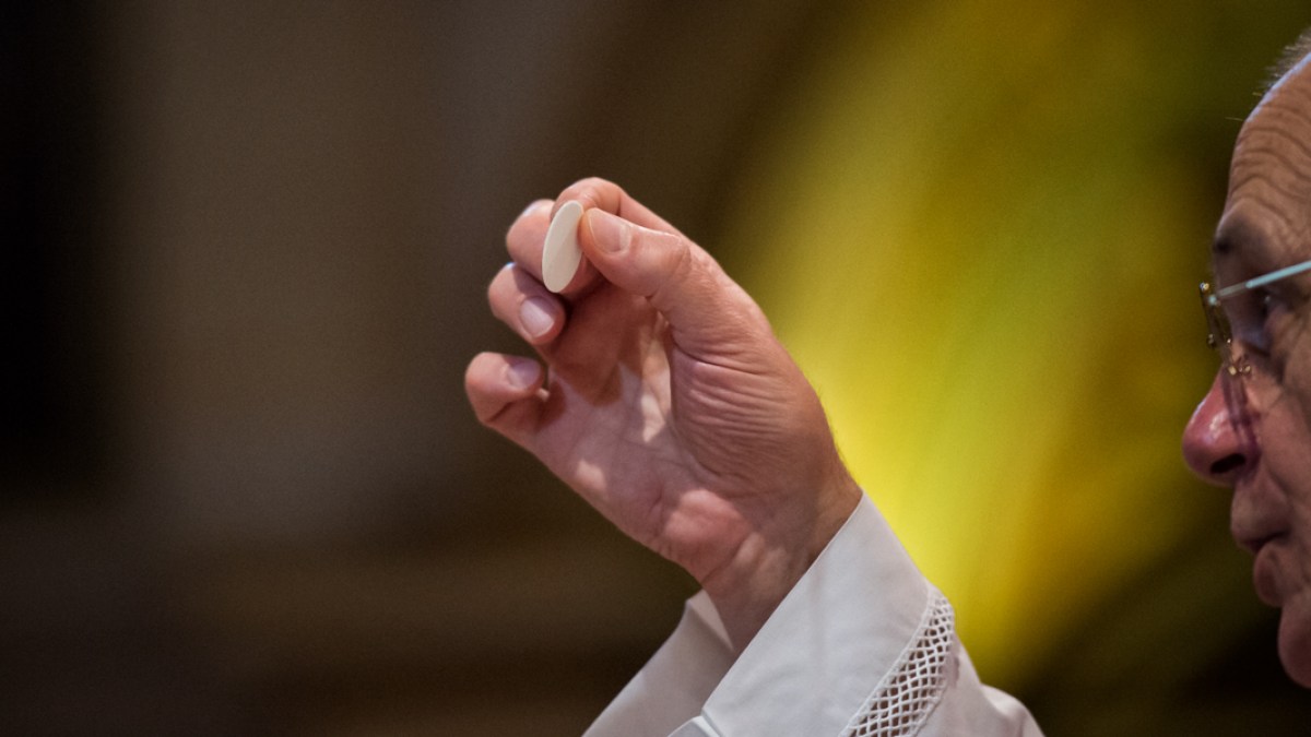 Holy Communion – Catholic priest