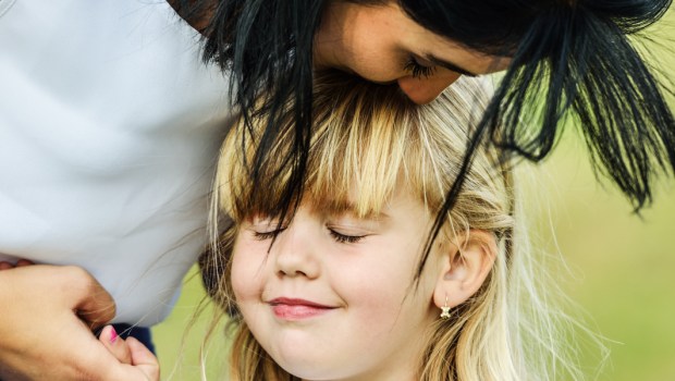 MOTHER EMBRACING CHILD