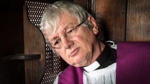 PRIEST IN CONFESSIONAL