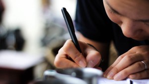 WOMAN WRITING A LETTER