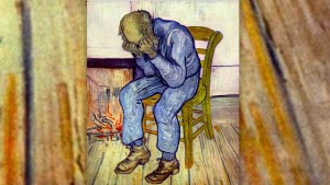 SAD MAN SITTING BY THE FIRE