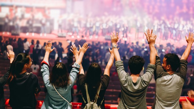 young praying raised hand
