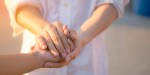 Man and woman holding hands