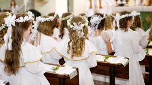 WEB3 GIRLS FIRST COMMUNION EUCHARIST Shutterstock