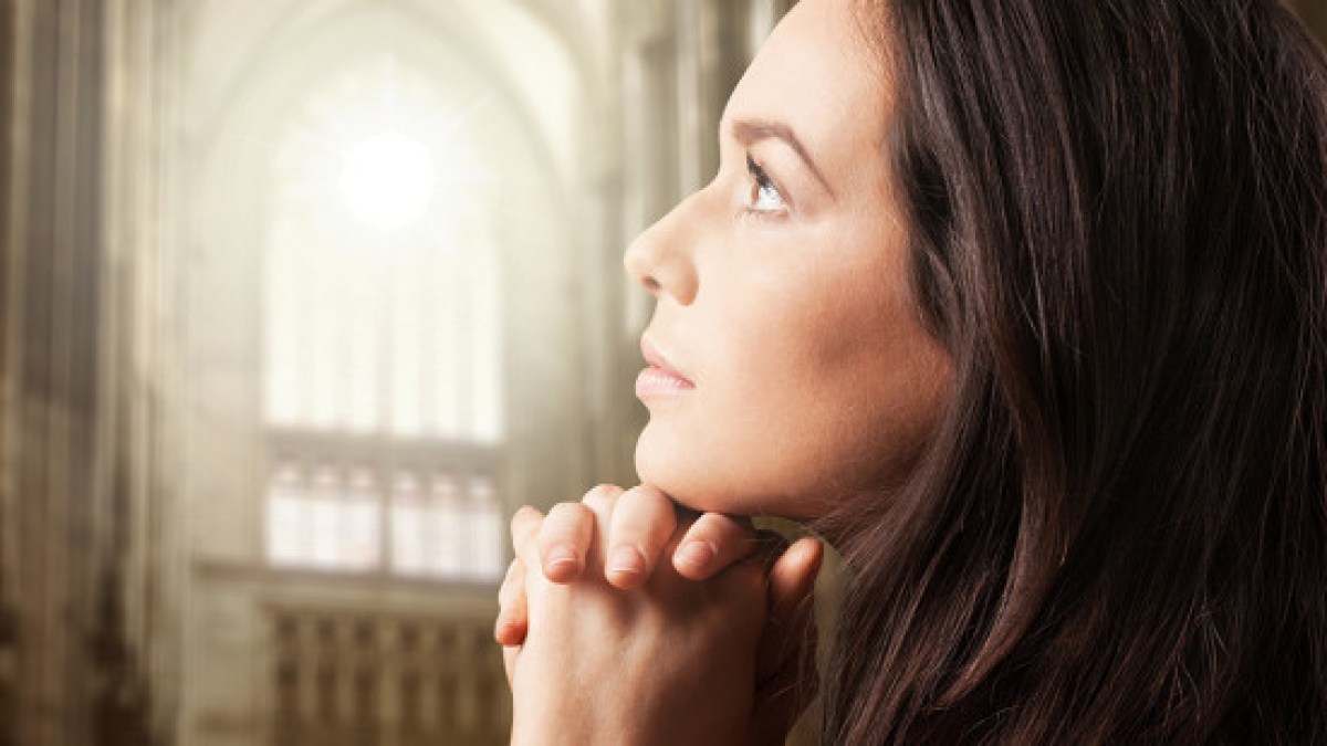 web3-woman-praying-cuhrch-light-shutterstock