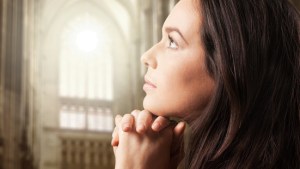 web3-woman-praying-cuhrch-light-shutterstock