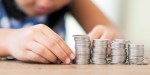CHILD COUNTING MONEY
