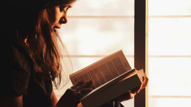 GIRL READING A BOOK