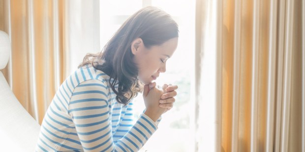 WOMAN PRAYING