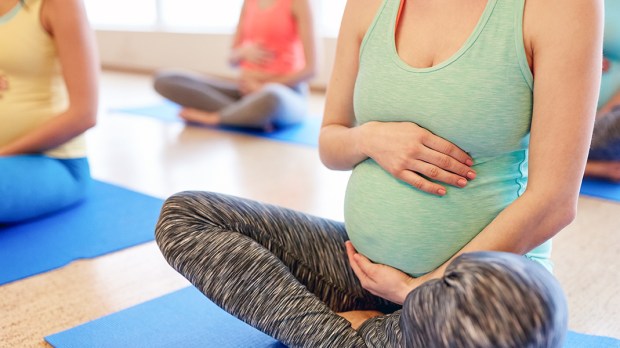 web3-pregnant-exercise-class-group-stretch-shutterstock_1041661003.jpg
