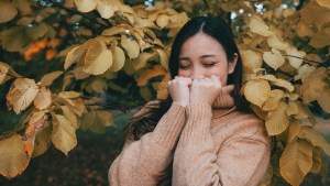 web3-woman-leaves-autumn-smile-kevin-laminto-unsplash-cc0