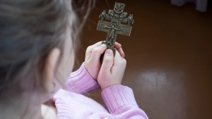 web3-girl-child-faith-cross-jesus-shutterstock.jpg