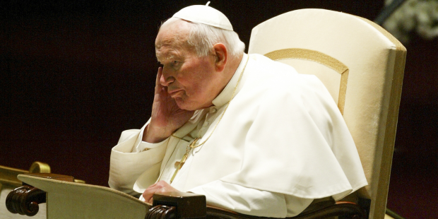 VATICAN CITY, VATICAN - 18 OCTOBER 2003: Pope John Paul II concentrates during the weekly general audience in the Nervi Hall at the Vatican.