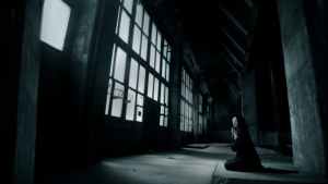 woman praying inside building