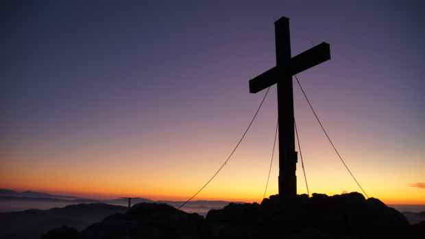 cross silhouette during golden hour