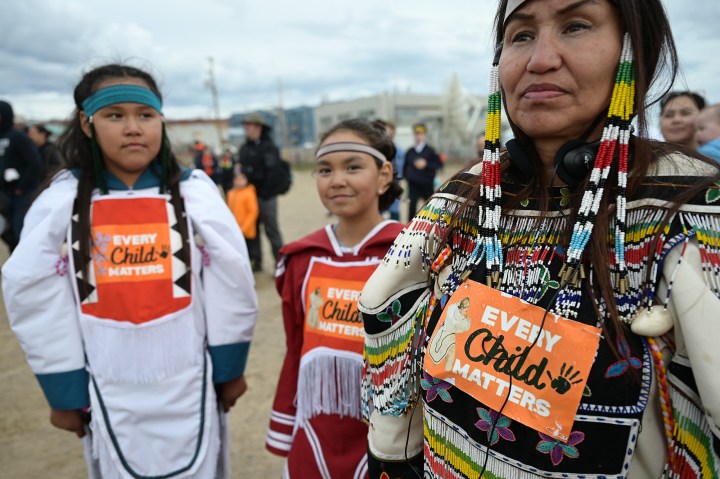 Indigenous-women-wearing-Every-Child-Matters-on-their-clothes-AFP