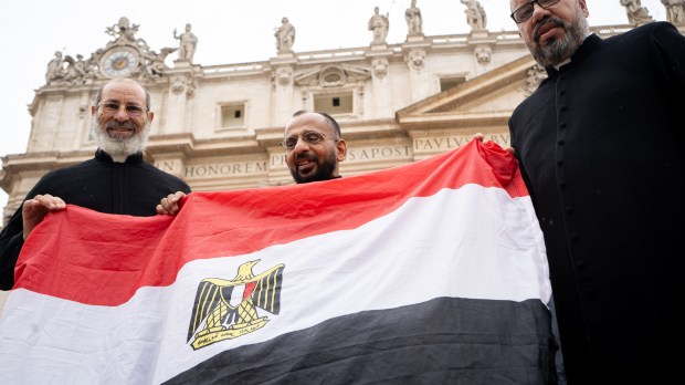 Coptic priests with flag of Egypt