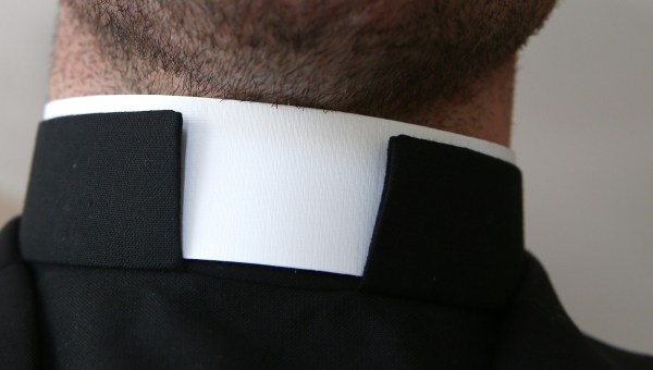 Catholic priest with collar around the neck