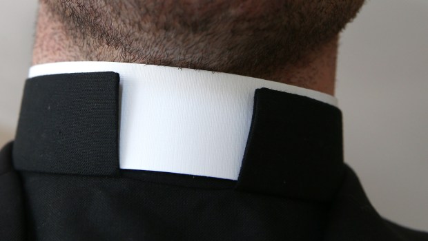 Catholic priest with collar around the neck
