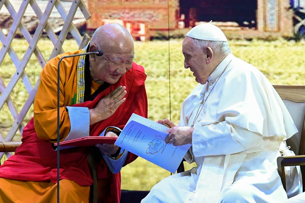Pope Francis talks with a religious leader during an Ecumenical and interreligious meeting in Ulaanbaatar