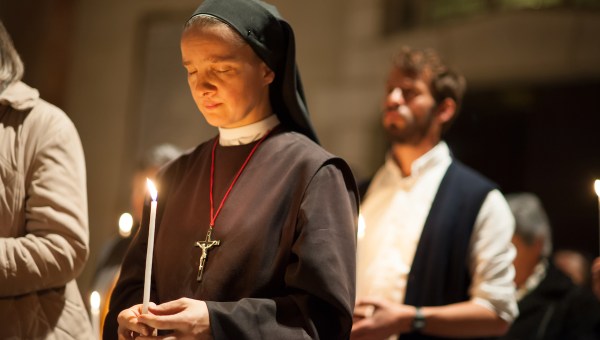 Nun holds candle East Jerusalem 2012
