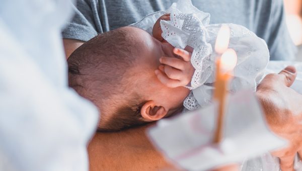 Baby during baptism closeup