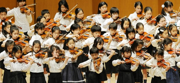Suzuki students perform in a 2008 memorial concert