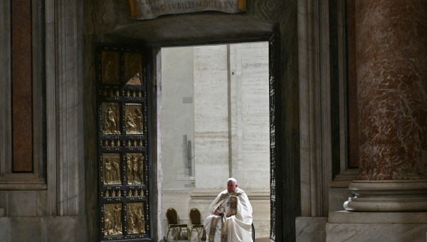 Pope Francis opens the Holy Door of St Peter's Basilica in the Vatican to mark the start of the Catholic Jubilee Year, on December 24, 2024