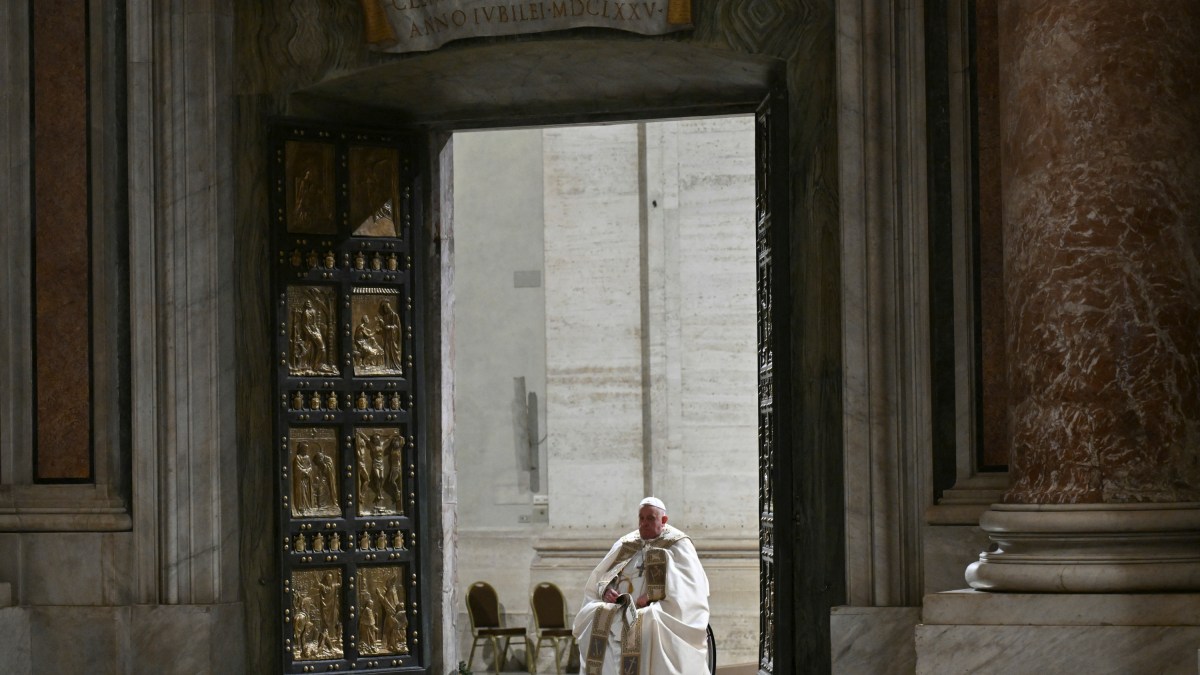 Pope Francis opens the Holy Door of St Peter's Basilica in the Vatican to mark the start of the Catholic Jubilee Year, on December 24, 2024
