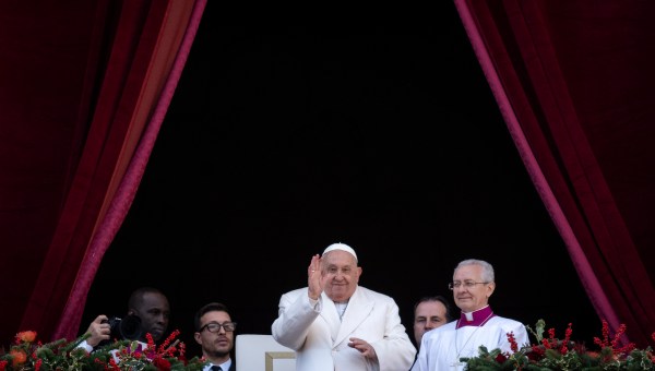 Pope Francis looks on from the main balcony of St. Peter's basilica after the Urbi et Orbi message and blessing to the city and the world as part of Christmas celebrations, at St Peter's square in the Vatican on December 25, 2024.