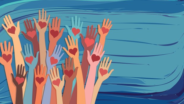 Banner whit abstract raised hands of multicultural volunteer people holding a heart