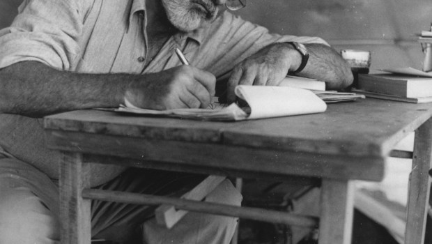 Ernest Hemingway writing in Kenya