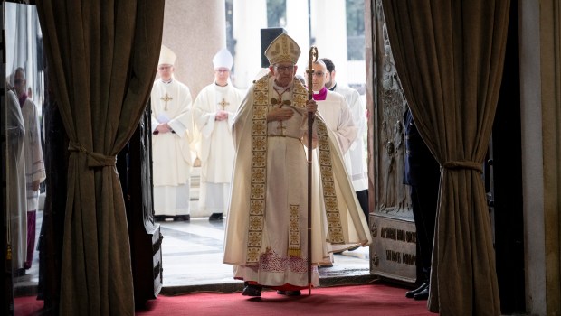 Cardinal James Michael Harvey opens the Holy Door of the Basilica of Saint Paul Outside the Walls during a ceremony for the Catholic Jubilee Year, in Rome on January 5, 2025