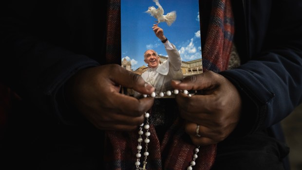 Priest pray the rosary in St. Peter's Square at The Vatican, Friday, Mar. 14, 2025
