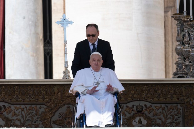 Pope Francis is pushed in a wheelchair on St. Peter's square to conduct the Angelus prayer in The Vatican, on April 6, 2025.