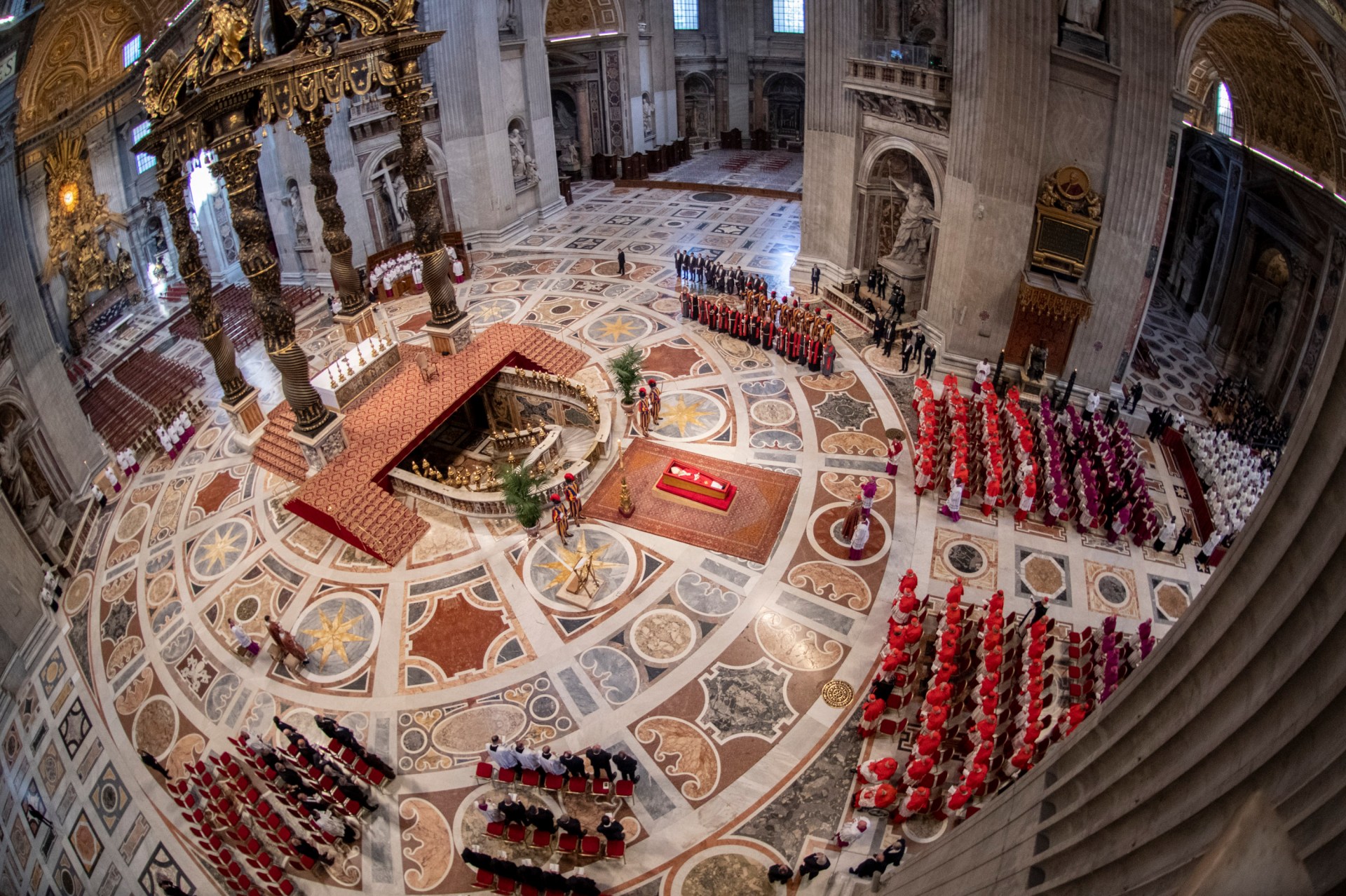 Pallbearers carry the coffin of the late Pope Francis inside St Peter's Basilica as it is transported in a procession from the chapel of Santa Marta to St Peter's Basilica, following the Pope's death, in the Vatican on April 23, 2025.
