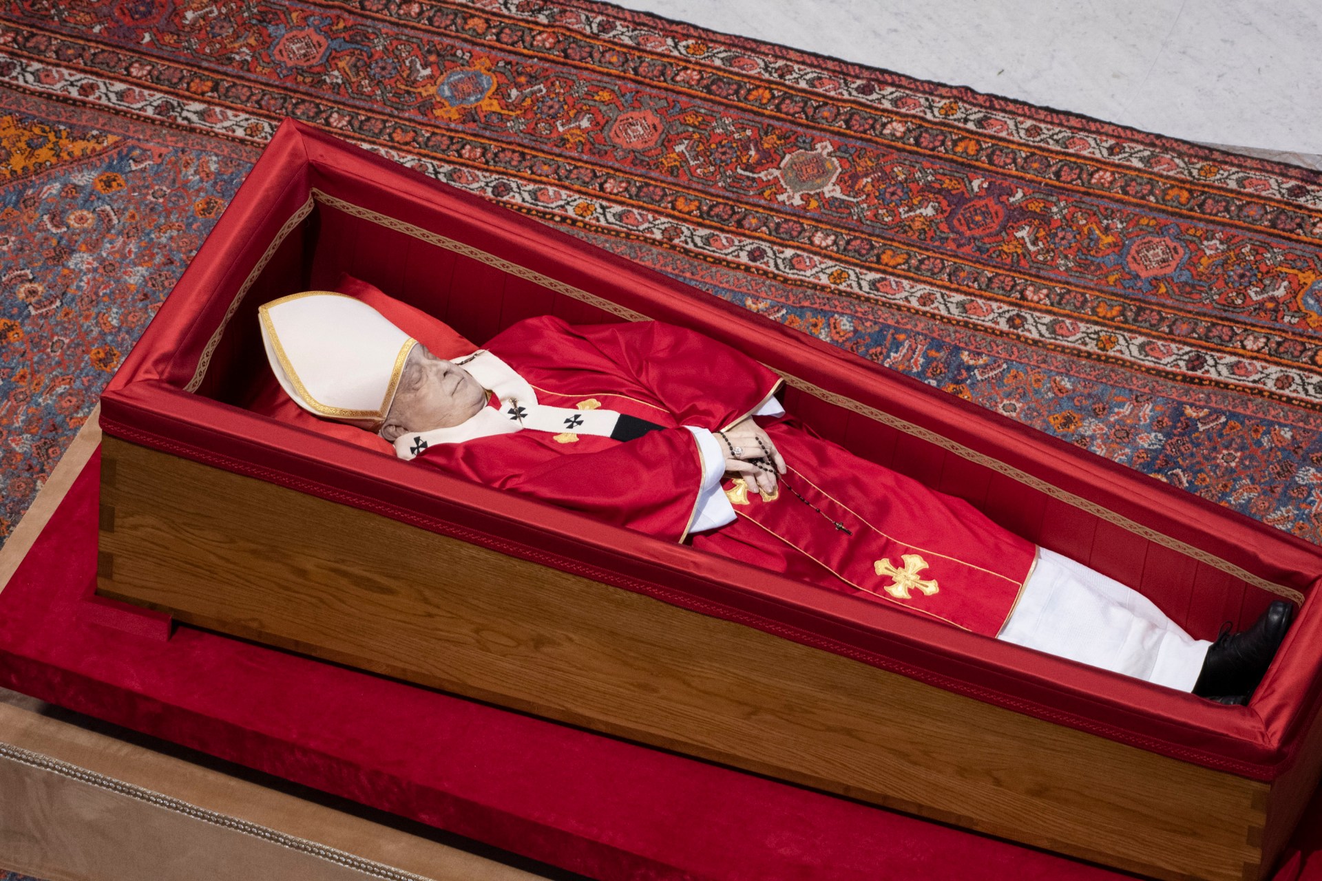 coffin of the late Pope Francis inside St Peter's Basilica as it is transported in a procession from the chapel of Santa Marta to St Peter's Basilica, following the Pope's death, in the Vatican on April 23, 2025.