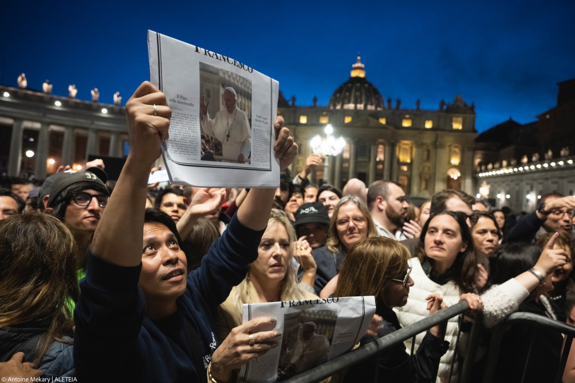 A man holds a special edition of the Vatican newspaper L'Osservatore Romano announcing the death of Pope Francis, in St. Peter's Square
